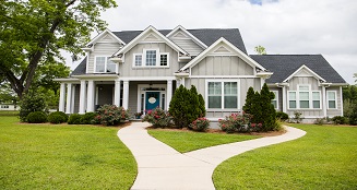 Photo of two storey house.